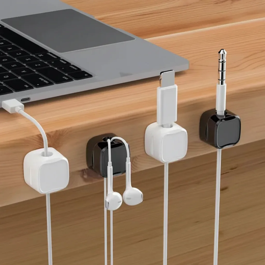 adhesive desk cable clips used to organize charging cables and earphones