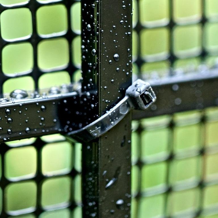 Heavy duty black zip tie securing a metal fence panel outdoors, demonstrating UV-resistant and weather-resistant performance.
