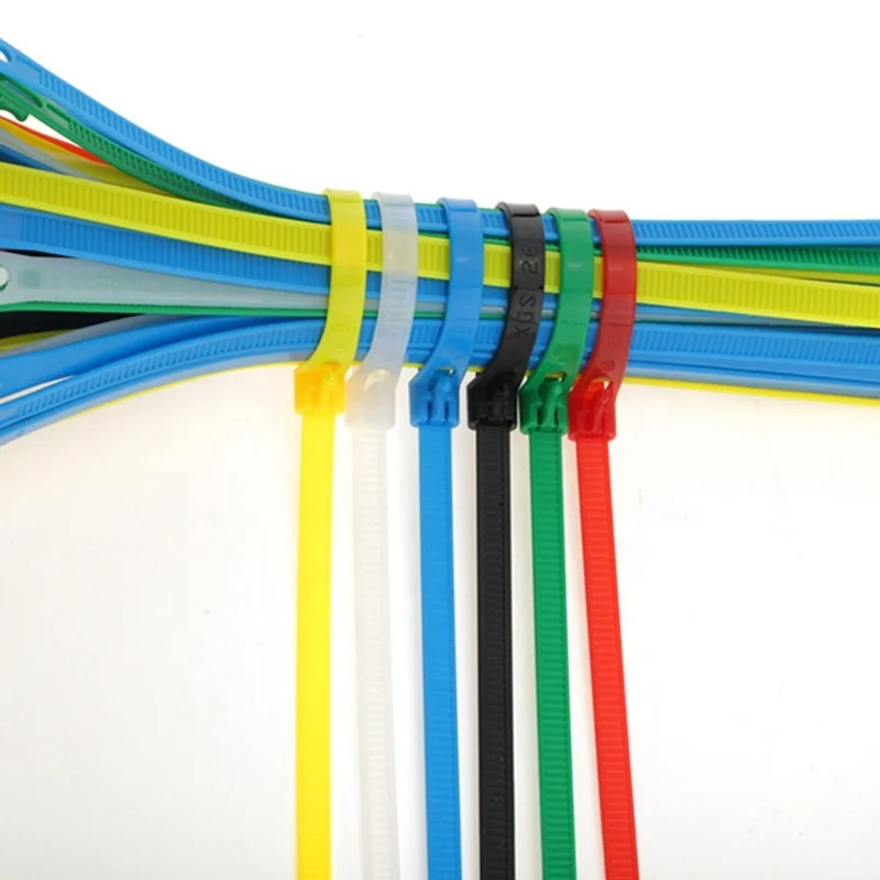 Assorted multi color zip ties used for cable management and wire organization showing color coded nylon cable ties in blue yellow green red black and white for industrial and household use