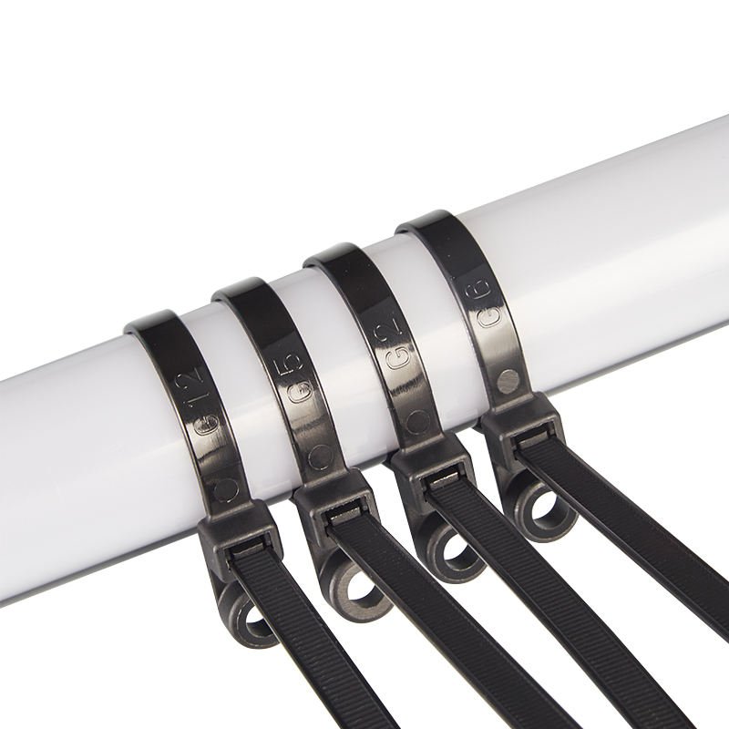 Black screw mount cable ties installed on white pipe rod showing industrial nylon zip ties used for secure cable management and organized fastening system