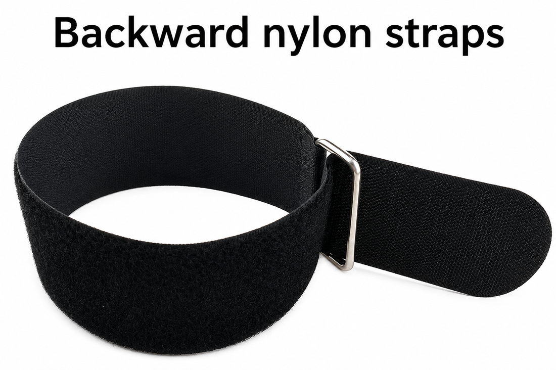 Black backward nylon hook and loop strap with metal buckle, adjustable for organizing cables and securing items