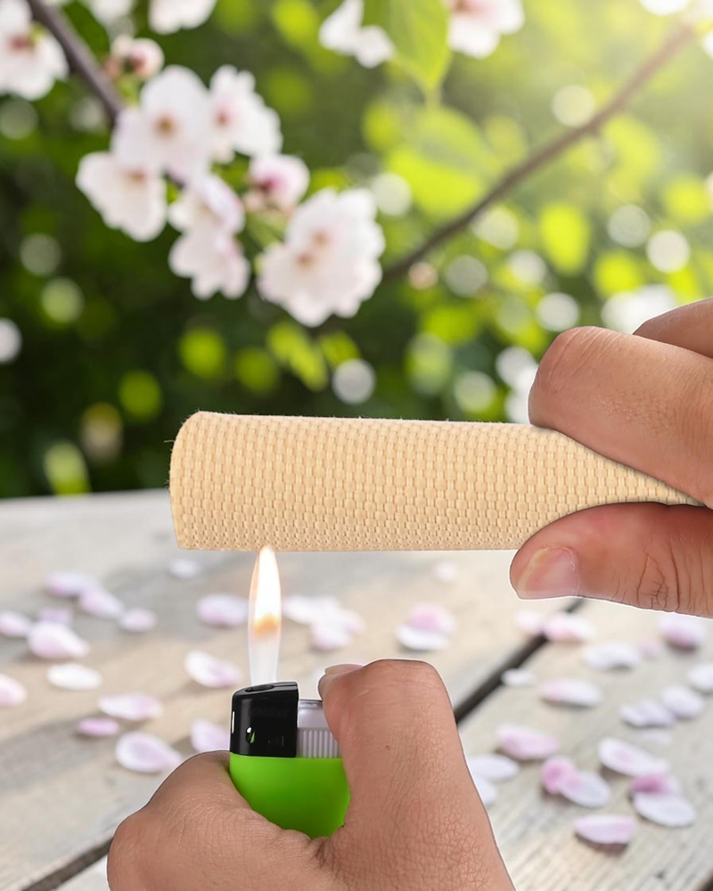 Beige flame resistant cable sleeve undergoing heat resistance testing with flame exposure, demonstrating durable braided wire protection for home, industrial, and automotive cable management.