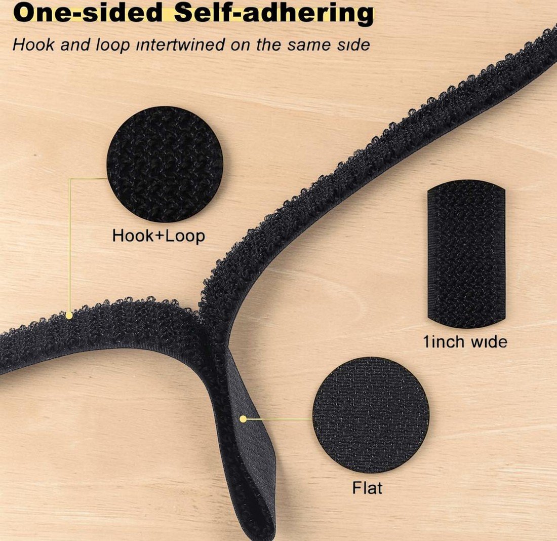 One-sided self-adhering black hook and loop strap displayed flat on a wooden surface, showing close-up views of the hook+loop texture, flat surface, and 1-inch width measurement.