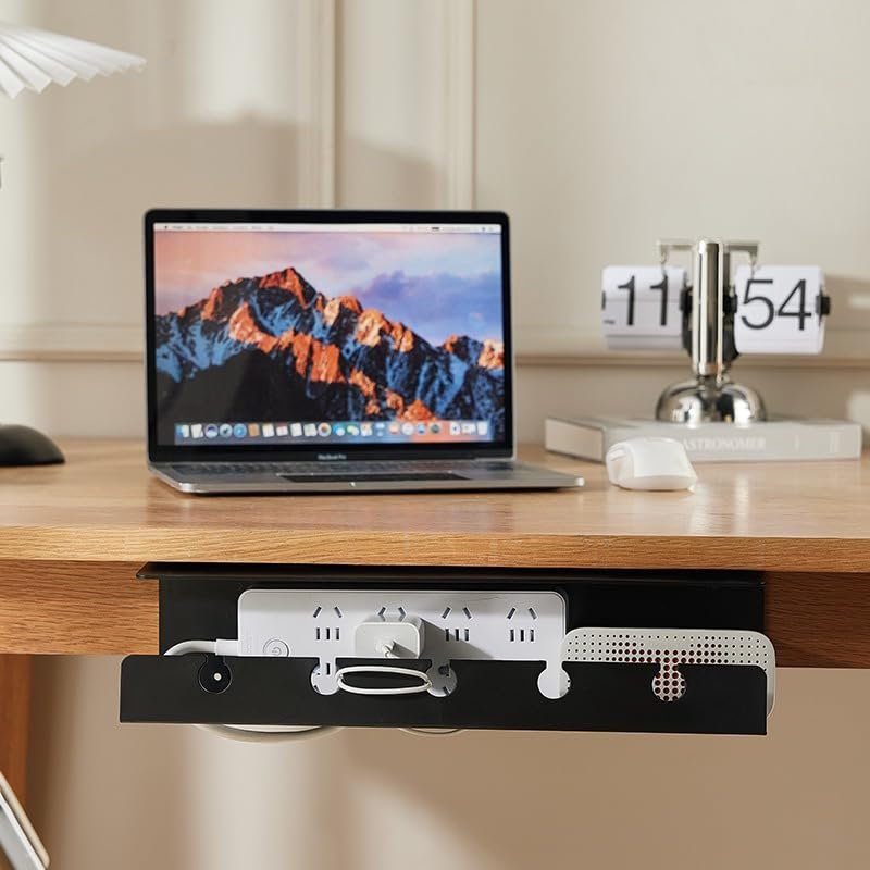 Under-desk power strip mounted alongside a cable management rack for organized cord routing