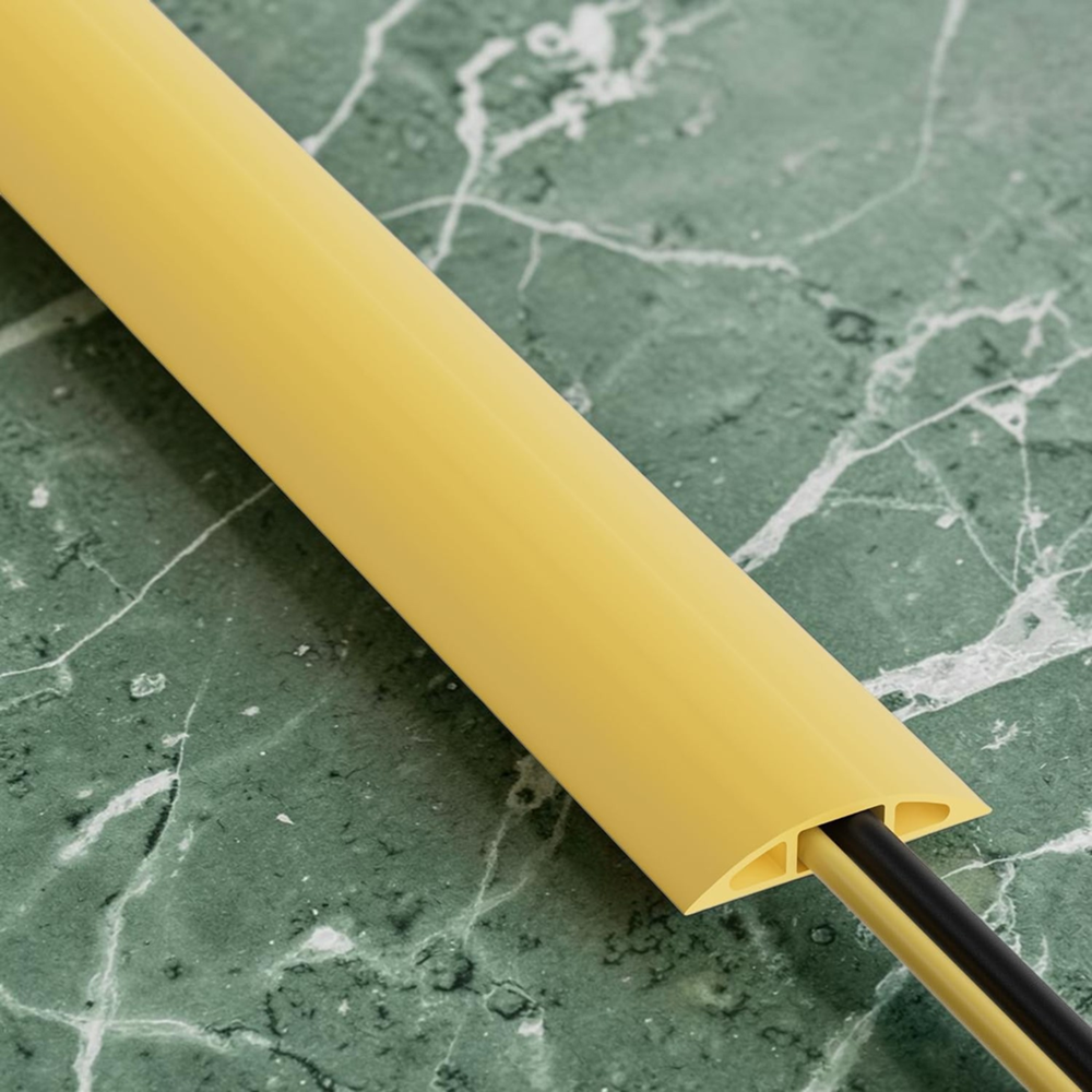 Yellow cord cover protecting electrical cables on marble floor, durable cable management protector for home and office use