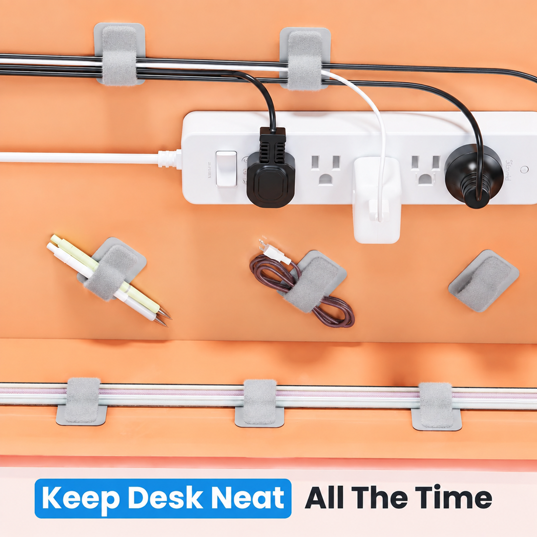 White adhesive cable clips organizing charging wires and power cords on a desk setup for clean cable management and workspace organization.
